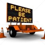 1324676_stock-photo-please-be-patient-construction-sign