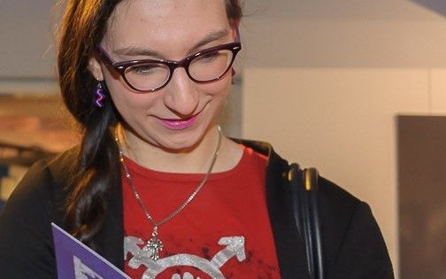 Exhibition guest enjoying the Twilight People booklet - special edition
